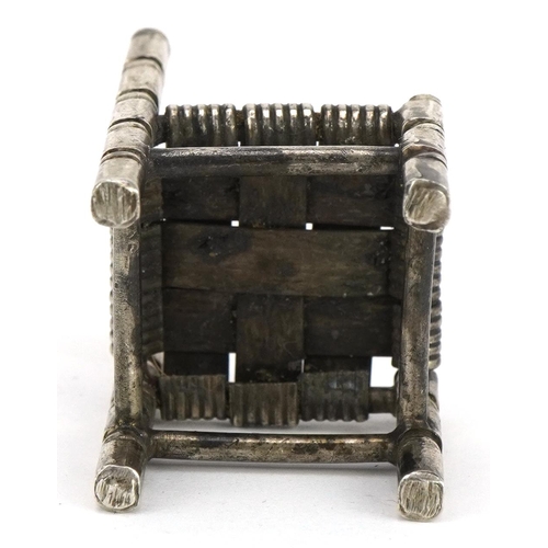 355 - Miniature Egyptian silver doll's house chair, 4.5cm high, 25.4g