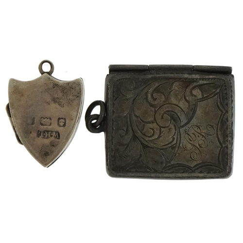 1617 - Edwardian silver stamp case in the form of an envelope and a silver shield shaped locket, the larges... 