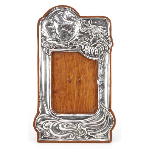 120 - Roberts & Belk Ltd, Art Nouveau style silver easel photo frame embossed with Jack Frost and moon wit... 