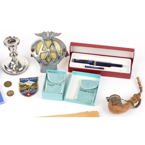 1679 - Sundry items including AA car badge, silvered dwarf candlestick and commemorative crowns