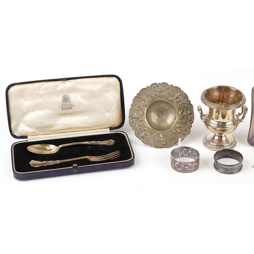 279 - Silver objects and a Persian white metal dish including urn with twin handles, square dish, christen... 