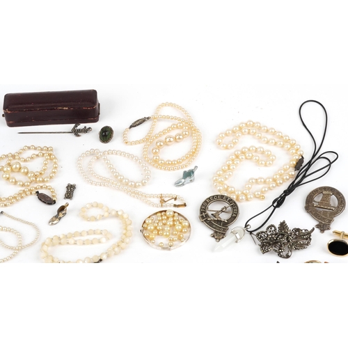 2550 - Vintage and later costume jewellery, some silver, and military badges including pearl necklace with ... 