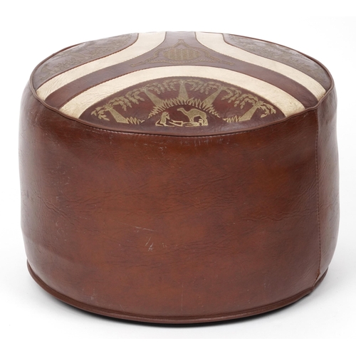 1076 - Sherborne circular leather footstool, the top with palm and camel decoration, 40cm in diameter