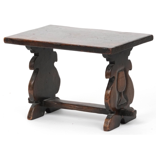 1157 - Carved oak refectory style stool carved with two wine goblets, 30cm H x 43cm W x 30cm D