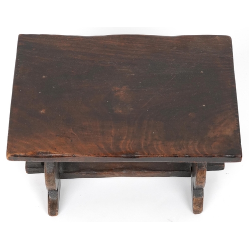 1157 - Carved oak refectory style stool carved with two wine goblets, 30cm H x 43cm W x 30cm D