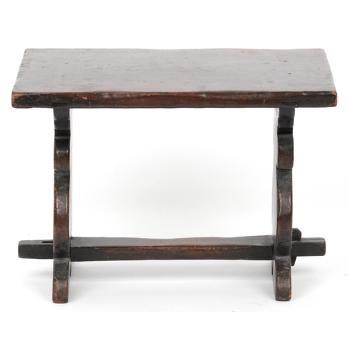 1157 - Carved oak refectory style stool carved with two wine goblets, 30cm H x 43cm W x 30cm D