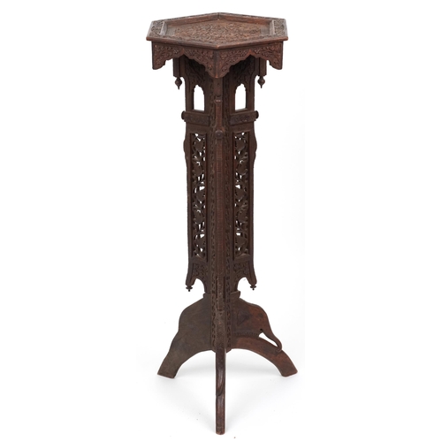 1093 - Anglo Indian plant stand profusely carved with flowers and foliage, 100cm high