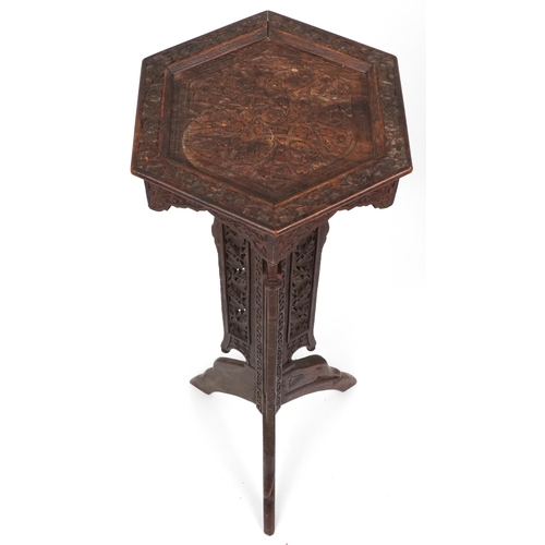 1093 - Anglo Indian plant stand profusely carved with flowers and foliage, 100cm high