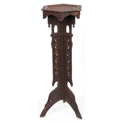 1093 - Anglo Indian plant stand profusely carved with flowers and foliage, 100cm high