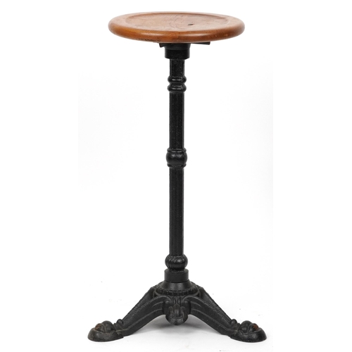 1074 - Industrial cast iron and oak circular occasional table, 74cm high x 31cm in diameter