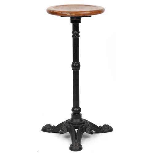 1073 - Industrial cast iron and oak circular occasional table, 74cm high x 31cm in diameter