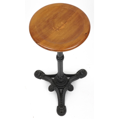 1073 - Industrial cast iron and oak circular occasional table, 74cm high x 31cm in diameter