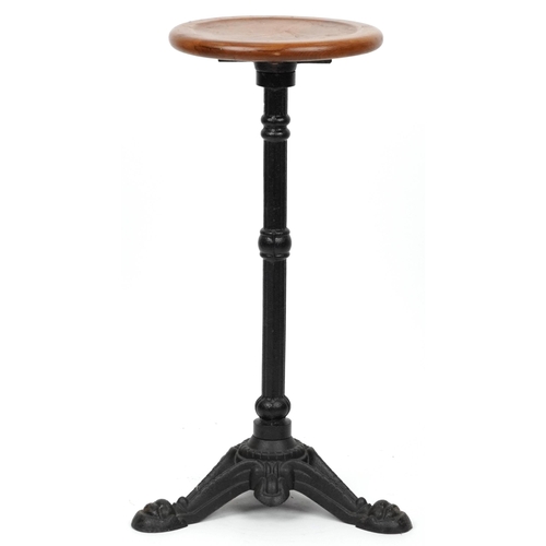 1073 - Industrial cast iron and oak circular occasional table, 74cm high x 31cm in diameter