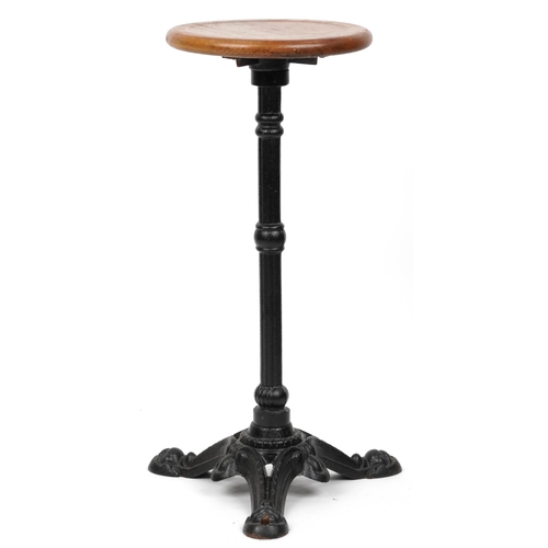 1075 - Industrial cast iron and oak circular occasional table, 74cm high x 31cm in diameter