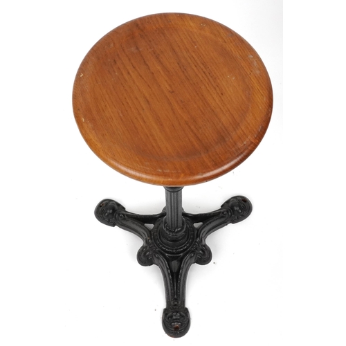 1075 - Industrial cast iron and oak circular occasional table, 74cm high x 31cm in diameter