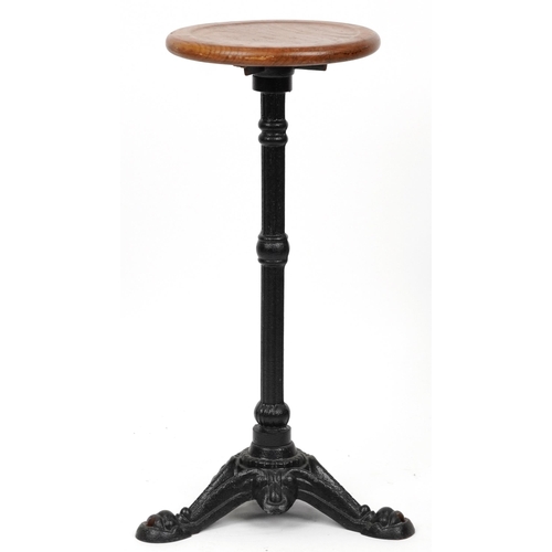 1075 - Industrial cast iron and oak circular occasional table, 74cm high x 31cm in diameter