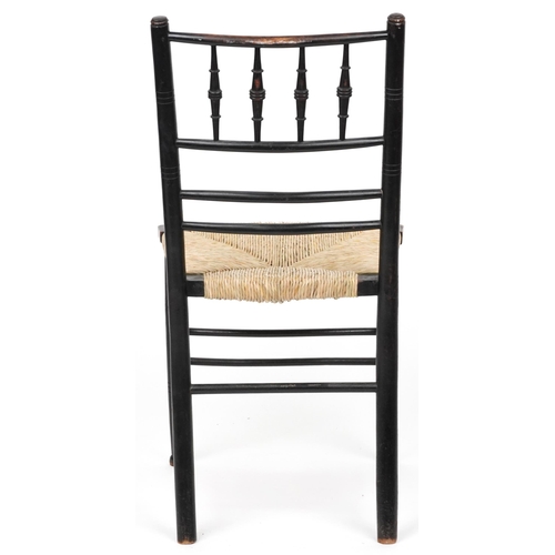 1089 - Attributed to Philip Webb for Morris & Co, Arts & Crafts ebonised Sussex chair retailed by Liberty o... 