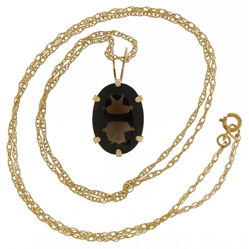 2091 - 9ct gold smoky quartz pendant on a 9ct gold necklace, 2cm high and 44cm in length, 2.3g