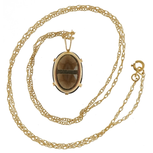 2091 - 9ct gold smoky quartz pendant on a 9ct gold necklace, 2cm high and 44cm in length, 2.3g