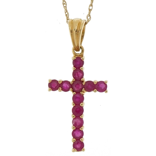 2109 - 9ct gold ruby cross pendant on a 9ct gold necklace, 2.5cm high and 44cm in length, 1.3g