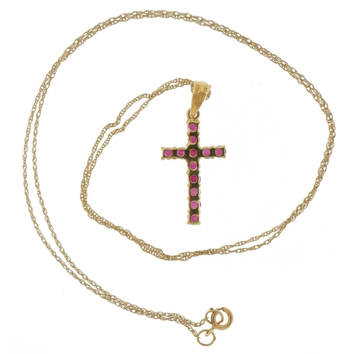 2109 - 9ct gold ruby cross pendant on a 9ct gold necklace, 2.5cm high and 44cm in length, 1.3g