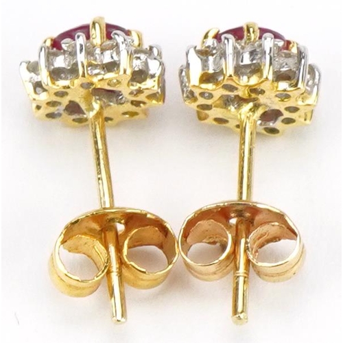 2132 - Pair of unmarked gold ruby and diamond stud earrings, tests as 18ct gold, 7mm in diameter, 1.8g