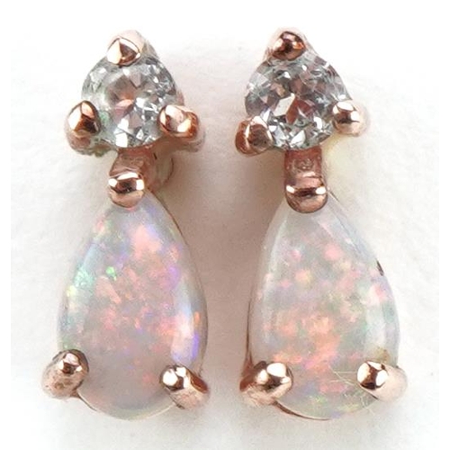 2097 - Pair of 9ct rose gold clear stone and opal stud earrings, 8.2mm high, 0.8g