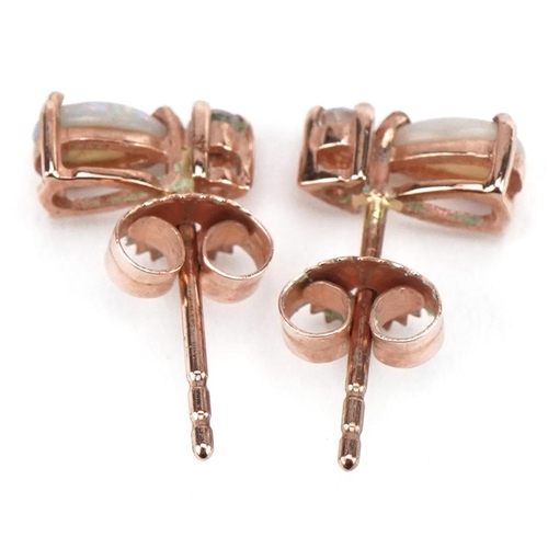 2097 - Pair of 9ct rose gold clear stone and opal stud earrings, 8.2mm high, 0.8g