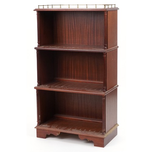 1087 - Mahogany four tier waterfall bookcase with brass gallery, 113cm H x 65cm W x 34cm D