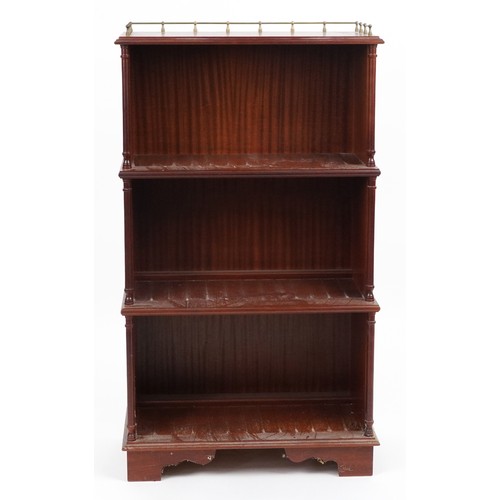 1087 - Mahogany four tier waterfall bookcase with brass gallery, 113cm H x 65cm W x 34cm D