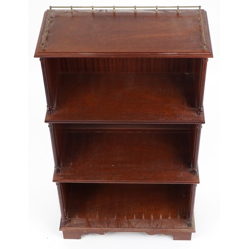 1087 - Mahogany four tier waterfall bookcase with brass gallery, 113cm H x 65cm W x 34cm D