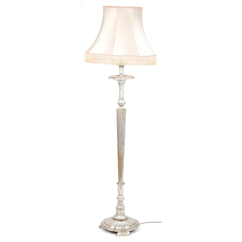 1054 - Classical silver gesso tapering standard lamp with silk lined shade, 181cm high