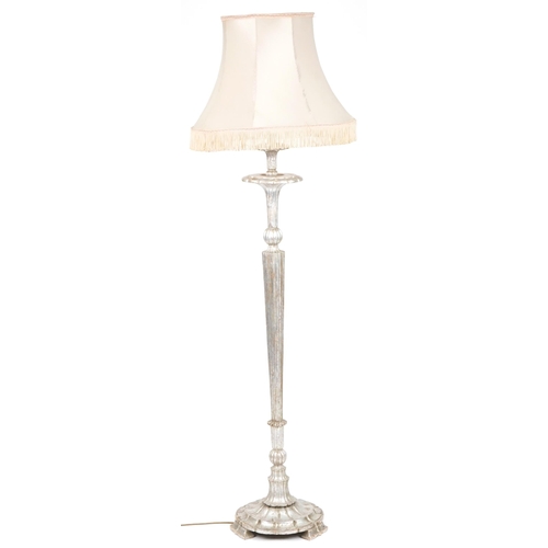 1054 - Classical silver gesso tapering standard lamp with silk lined shade, 181cm high