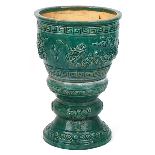 1101 - Chinese porcelain jardiniere on stand having green glaze decorated in relief with dragons chasing th... 