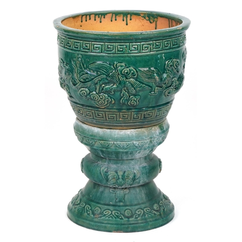 1101 - Chinese porcelain jardiniere on stand having green glaze decorated in relief with dragons chasing th... 