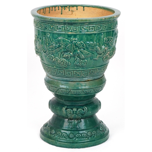 1102 - Chinese porcelain jardiniere on stand having green glaze decorated in relief with dragons chasing th... 