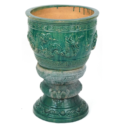 1102 - Chinese porcelain jardiniere on stand having green glaze decorated in relief with dragons chasing th... 