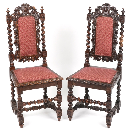 1088 - Pair of 19th century oak hall chairs with barley twist supports profusely carved with leaves and ber... 