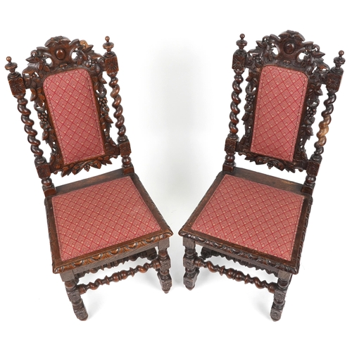 1088 - Pair of 19th century oak hall chairs with barley twist supports profusely carved with leaves and ber... 