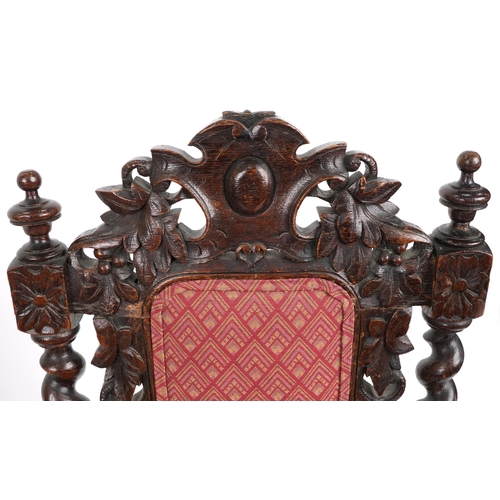 1088 - Pair of 19th century oak hall chairs with barley twist supports profusely carved with leaves and ber... 