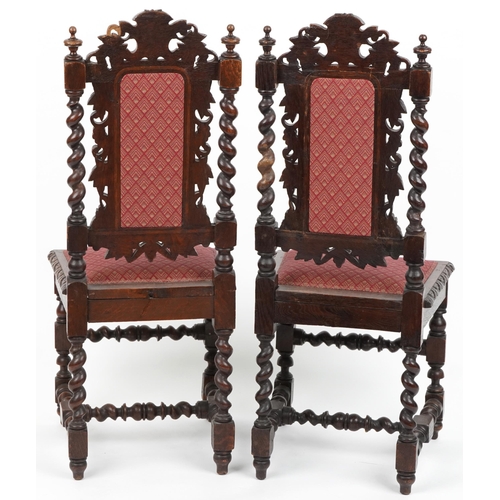 1088 - Pair of 19th century oak hall chairs with barley twist supports profusely carved with leaves and ber... 