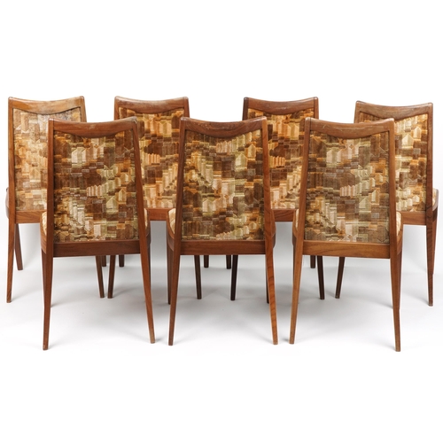 1129 - Seven mid century G Plan teak dining chairs with geometric upholstered back and seats, each 92cm hig... 