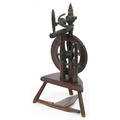 1066 - Antique carved oak spinning wheel, 78cm high