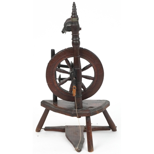 1066 - Antique carved oak spinning wheel, 78cm high