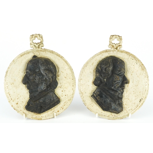 485 - Pair of 19th century cast iron portrait plaques comprising William Gladstone and Benjamin Dizrali, e... 