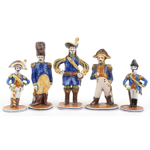 1604 - Set of five continental faience glazed figures of soldiers in uniform, the largest 28cm high