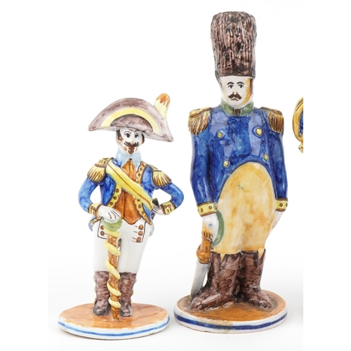 1604 - Set of five continental faience glazed figures of soldiers in uniform, the largest 28cm high