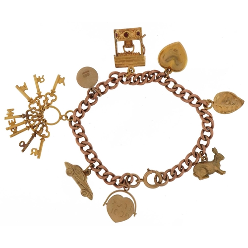 2123 - 9ct gold charm bracelet with eight 9ct gold charms including bunch of keys, wishing well, enamelled ... 