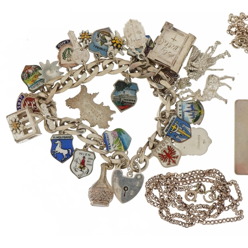 2587 - Silver jewellery including a charm bracelet with enamelled souvenir shields, Elizabeth II Silver Jub... 