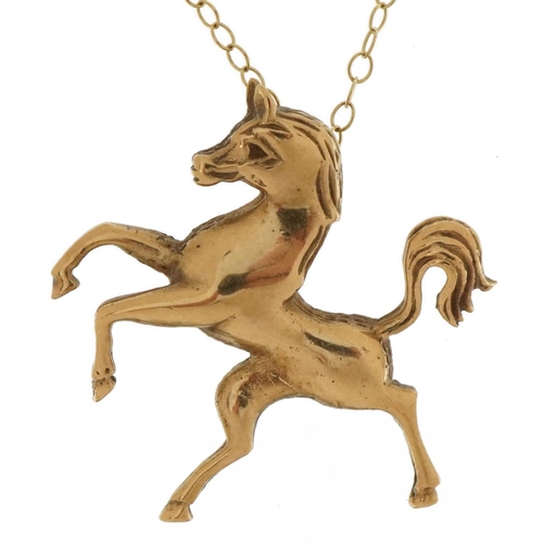 2106 - 9ct gold rearing horse pendant on 9ct gold necklace, 3cm high and 42cm in length, 4.7g